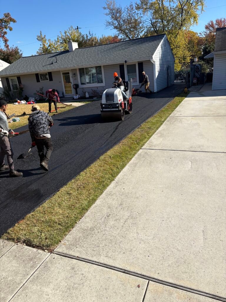 Driveway paving crew installing fresh asphalt driveway in Bucks County PA